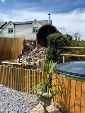 The lodge spa with sauna hot tub firepit and entertainment areas